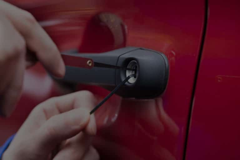 A Locksmith Hand Opening A Car's Door