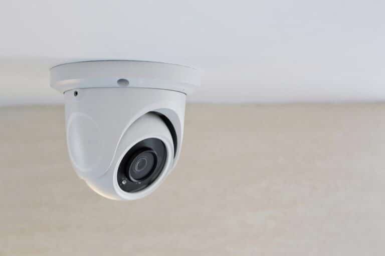 White Security Camera Mounted On The Ceiling